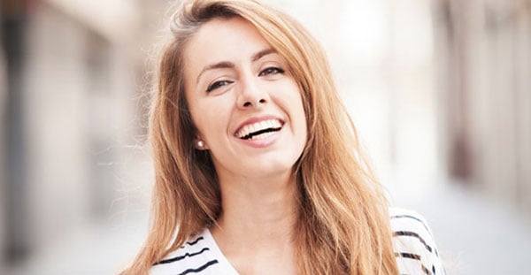Woman in stripped shirt smiling
