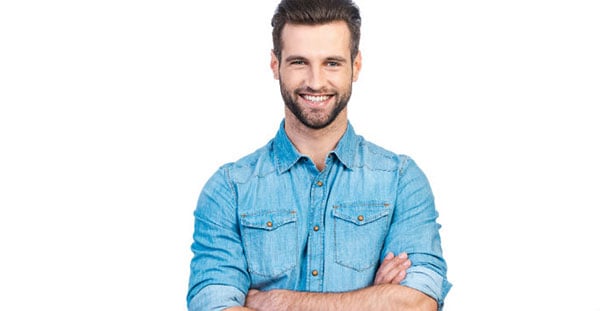 Man with arms crossed, smiling