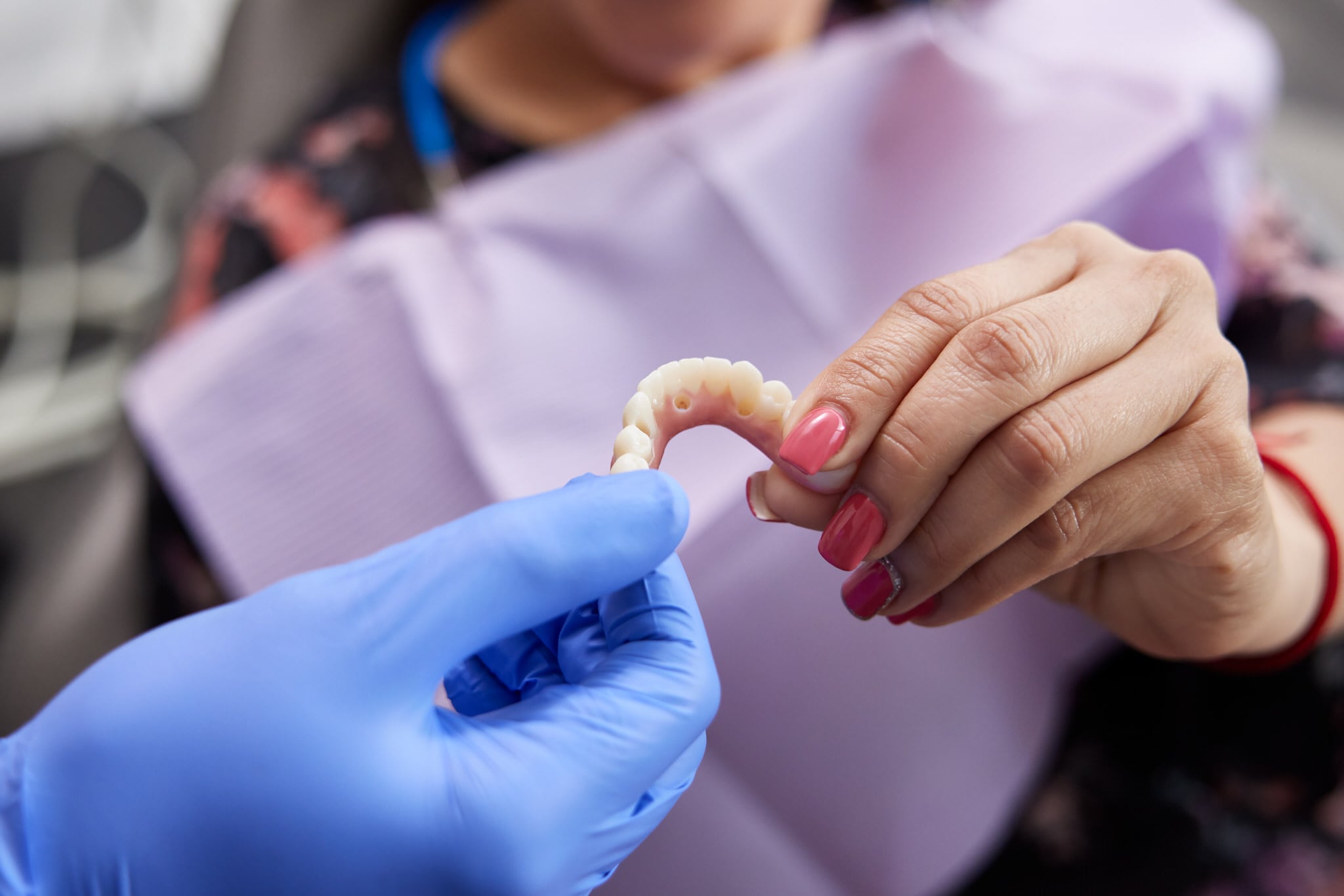 Patient checking out an ArchONE dental implant