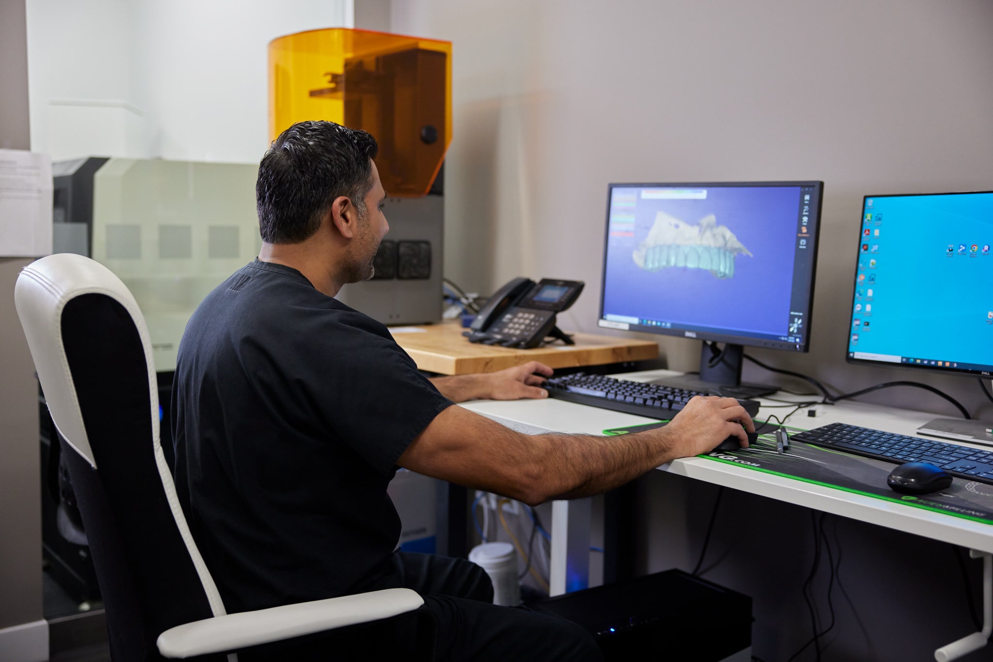 Doctor examining 3D rendition of teeth