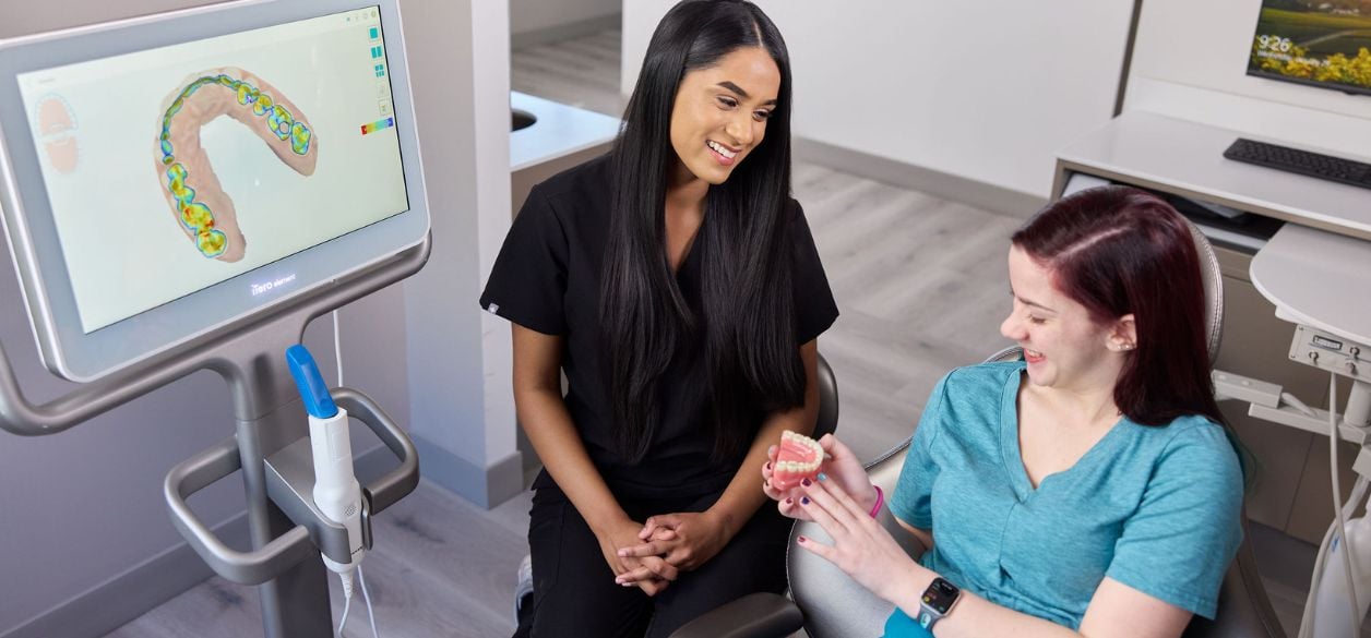 CascadesONE dentist Dr. Stanley consulting a patient on dental bridges