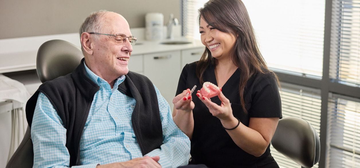 CascadesONE dental hygienist showing patient Invisalign