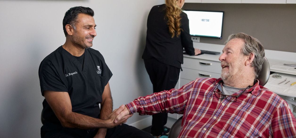 Dr. Ruparelia consulting a CascadesONE Dental patient