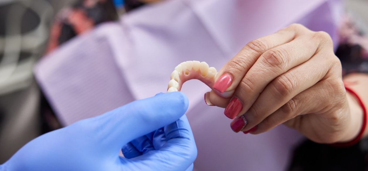 CascadesONE doctor showing patient dental implant
